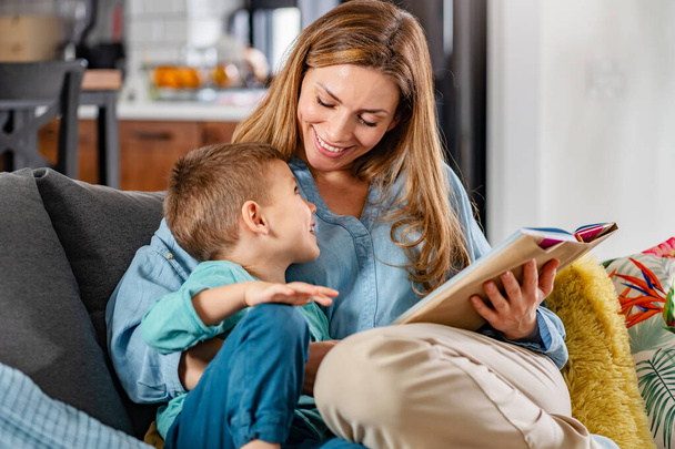 mother with son reading book - Photo, Image