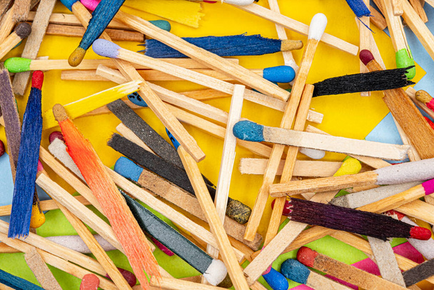 matchsticks of various shapes and colors with multicolored paper sticky notes on background - Foto, Imagem
