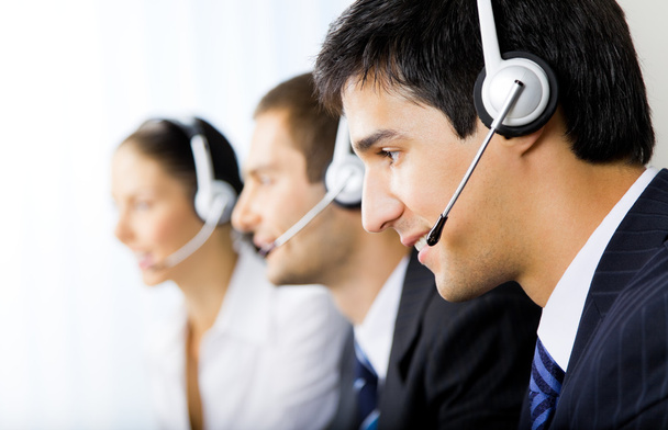 Three support phone operators at workplace - Zdjęcie, obraz