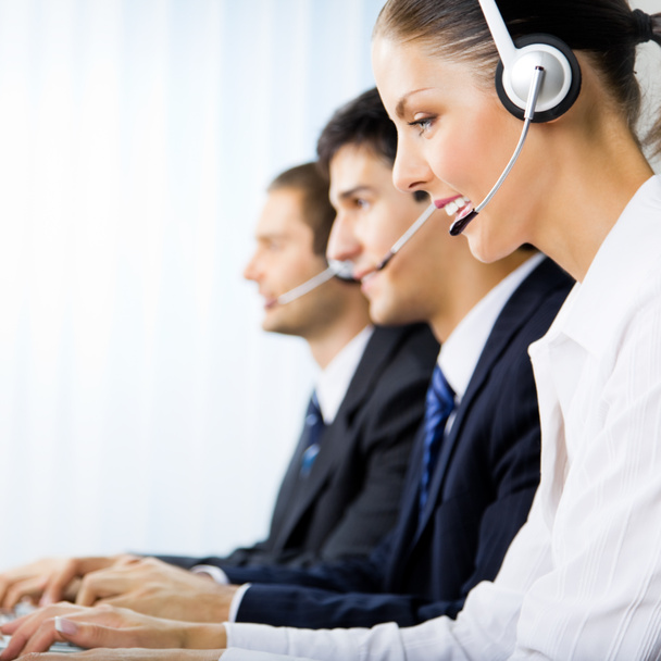 Three support phone operators at workplace - Zdjęcie, obraz
