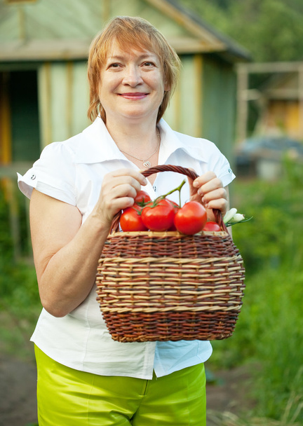 Happy mature woman with vegetables  - Valokuva, kuva
