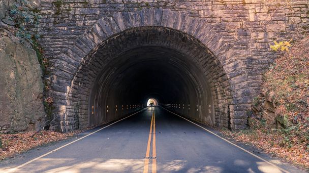 Car is driving through a tunnel on the Blue Ridge Parkway near Asheville, North Carolina - Foto, immagini