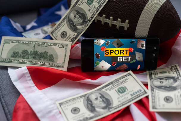 smartphone, money and rugby ball on light background. Concept of sports bet. - Foto, Imagem