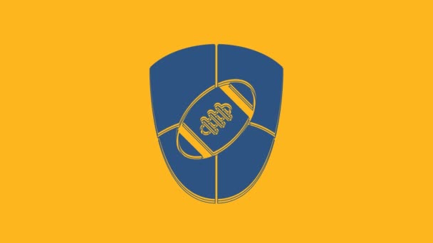 Modrá americká fotbalový a štít ikona izolované na oranžovém pozadí. Ragbyová ikona. Symbol týmové sportovní hry. Grafická animace pohybu videa 4K. - Záběry, video