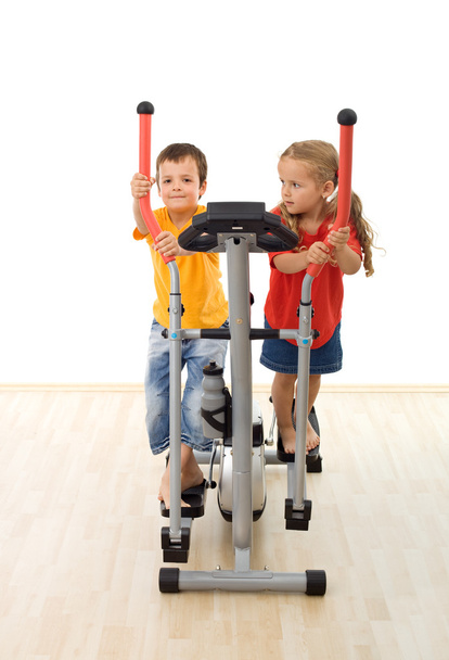 Kids having fun playing on exercise equipment - Photo, image