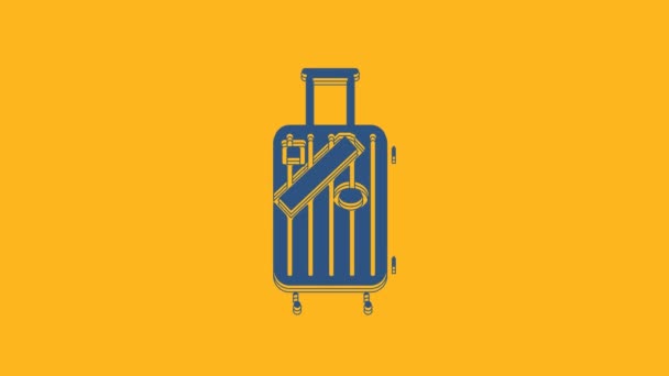 Blue Suitcase for travel and stickers icon isolated on orange background. Traveling baggage sign. Travel luggage icon. 4K Video motion graphic animation. - Footage, Video