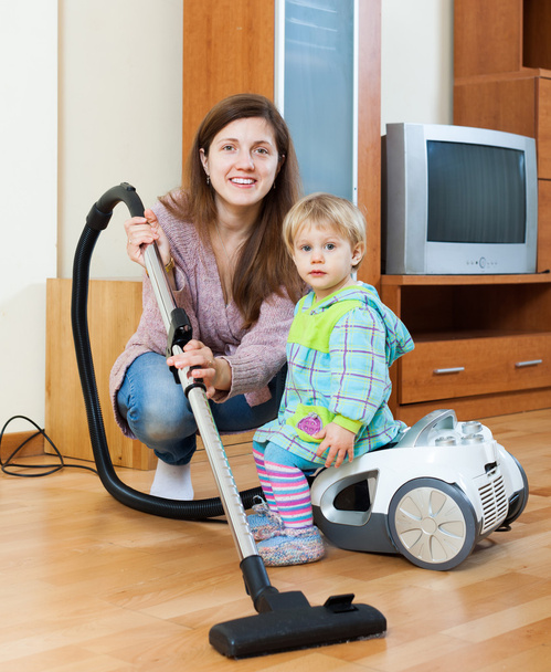 Mother with child cleaning home - Foto, imagen