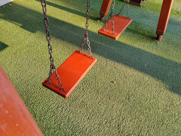 Swing playground in the morning sunlight in spring - Foto, Imagen