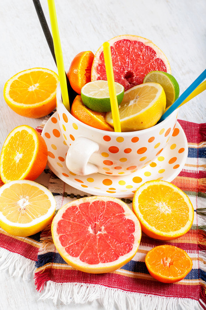 Big cup with fresh citrus fruits - Photo, Image