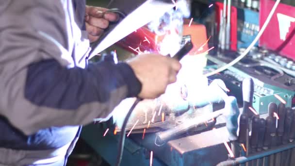 Welder with Welding Electrode on the Workbench Vice - Footage, Video
