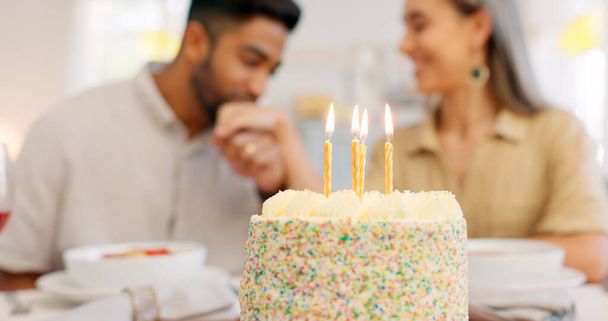 Cake, anniversary or birthday, couple celebrate and romantic together, kiss and love during dinner date. Young, man and woman, relationship growth and spending quality time, food and dessert to enjoy. - Photo, image