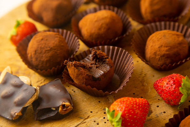 Premium quality chocolate truffles with strawberries. - Photo, Image