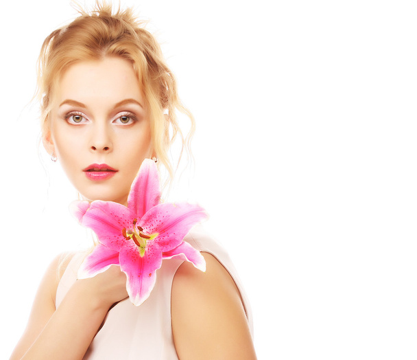 young woman with pink lily - Foto, afbeelding