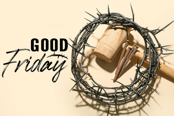 Crown of thorns, mallet, nails and text GOOD FRIDAY on beige background - Photo, Image