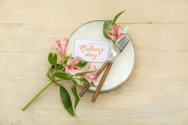 Table setting for Mother's Day celebration with alstroemeria flowers on wooden background - Photo, Image