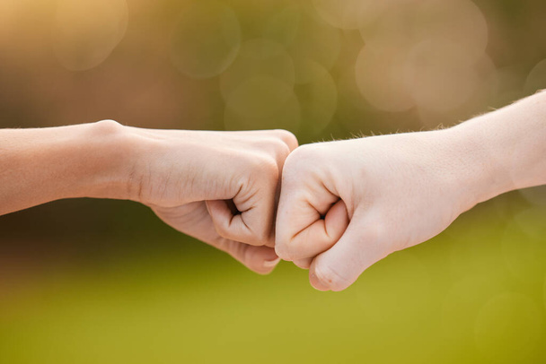 Hands, fist bump and teamwork, support or collaboration for team building, solidarity or unity. Hand connection, partnership or greeting, thank you or motivation for success, goal or targets outdoors. - Photo, Image