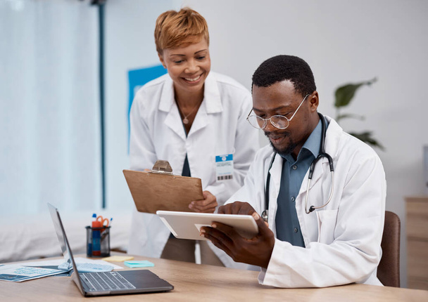 Teamwork, tablet and doctors in research training, hospital data and healthcare app management. Telehealth, digital technology and analysis of medical professional or black people working in office. - Photo, Image