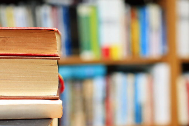 stack of books on shelves, education concept-blurred background - 写真・画像