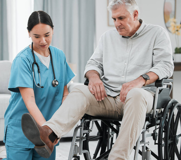 Wheelchair help, nursing home and man with injury or disability with nurse support. Wellness, healthcare and retirement of a elderly person with foot pain from a medical problem with caregiver. - Photo, Image