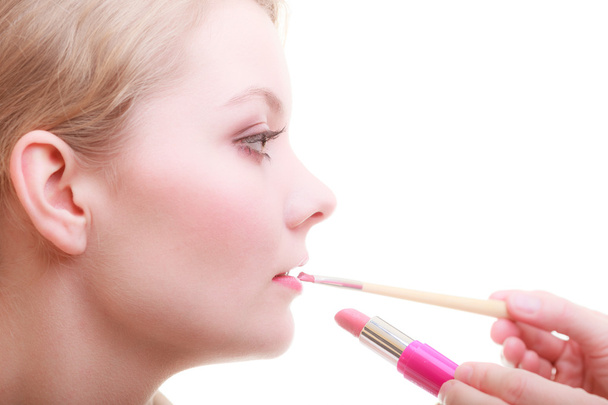 Woman applying red lipstick - Φωτογραφία, εικόνα