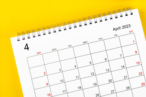 April 2023 Monthly desk calendar for 2023 year on yellow color background. - Foto, Imagem