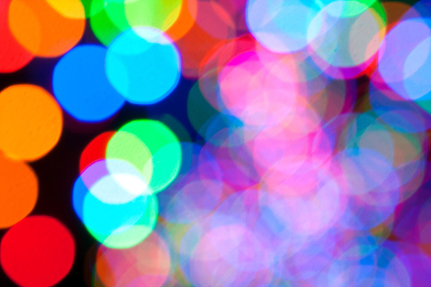 Coloridas luces navideñas crean fondo de Bokeh
 - Foto, imagen