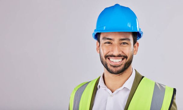 Portrait, civil engineering or contractor in studio with smile after planning a real estate building construction. Designer, architecture or happy man with vision of renovation in project management. - Photo, Image