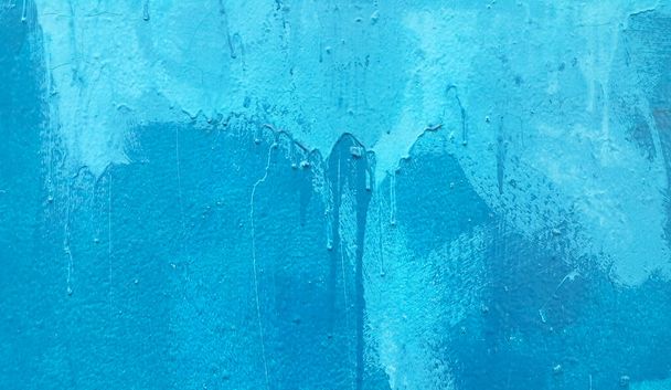 Bright blue painted wall texture with stains and smudges - Photo, image