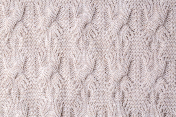 ニットの質感。ウールで作られたパターン生地。背景、コピースペース。手作りのセーターのテクスチャ、ニットウールパターン - 写真・画像