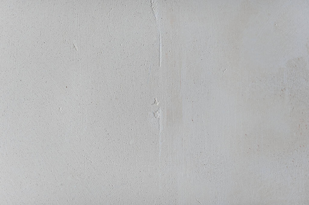 Texture of gypsum plaster of light color. Graphic plaster stains. Rough stone for applying paint. External rough decorative motif - Foto, Imagem