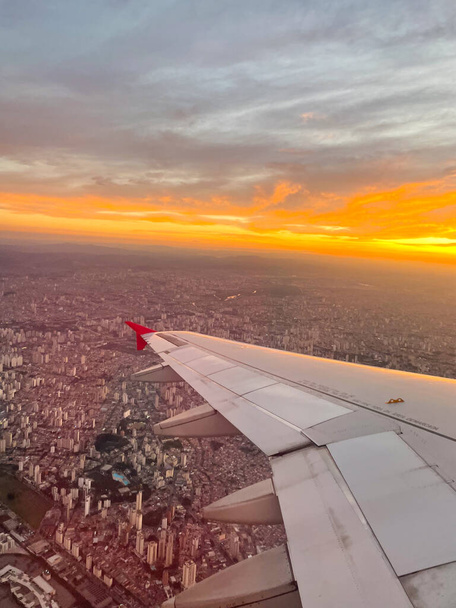 view from the window of an airplane. turbine of an airplane under the Sao Paulo, Brazil. .At the sunset. - Photo, Image