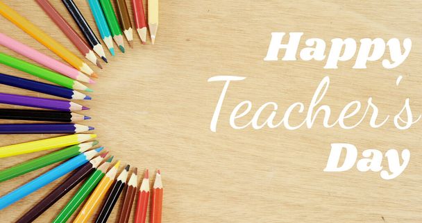 Image of happy teachers day text over pencils. school, education and study concept digitally generated image. - Foto, Bild