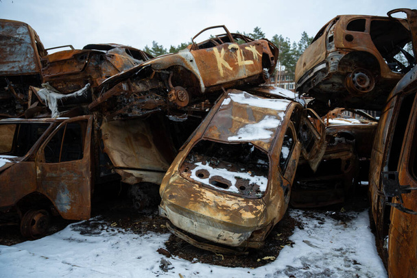 03.02.2023 Irpin, Ukraine: Stacked a bunch of crashed cars after fire and missiles attacks in city - Valokuva, kuva
