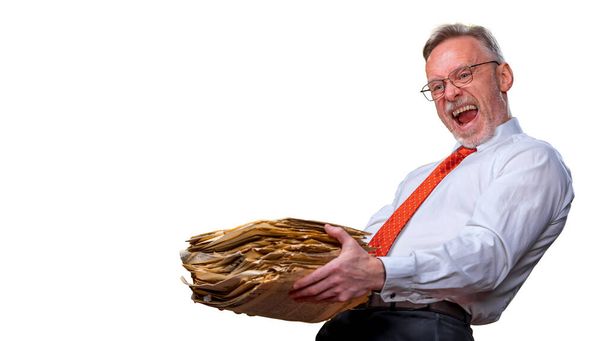 Pile of documents in hands. Senior man holding piles of documents paperwork on a white background. Surprised of hard mental work - Foto, Imagen