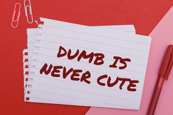 Handwriting text Dumb Is Never Cute, Business idea Rational steps taken by a person to avoid committing a tort - Zdjęcie, obraz