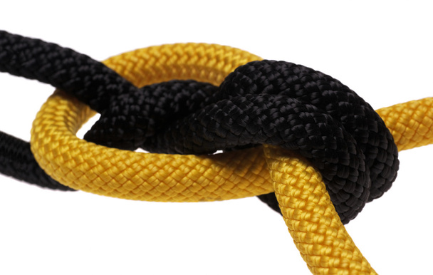 Двойной узел. черные и желтые веревки
. - Фото, изображение