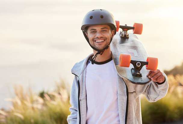 Smile, longboard and portrait of man with skateboarding hobby, skill and balance on road. Freedom, urban fun and face of happy gen z skateboarder, cool guy holding skateboard with happiness and sport. - Fotoğraf, Görsel
