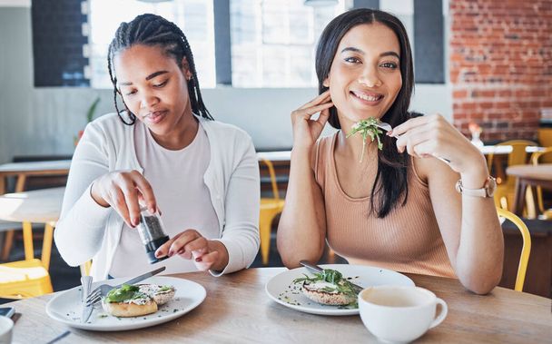 Food, friends and portrait of women in cafe eating together on lunch date on fun summer weekend. Friendship, social and hungry people, woman and girl friend in restaurant or coffee shop with sandwich. - Foto, afbeelding