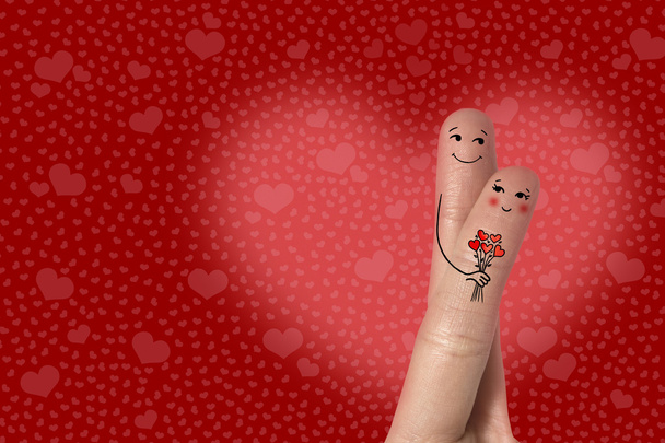 Finger art of a Happy couple. Man is giving bouquet. Stock Image - Photo, Image