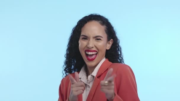 Face, finger gun and black woman with success, celebration and achievement against a blue studio background. Portrait, Jamaican female and happy lady with gesture for shooting, happiness and pointing. - Video