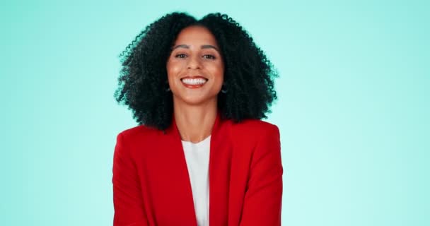 Face, black woman and employee with smile, funny and success with lady against a blue studio background. Portrait, Jamaican female and girl laughing, happiness and carefree with joyful and cheerful. - Footage, Video
