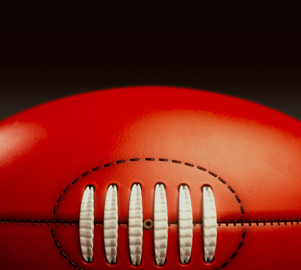 A generic unbranded aussie rules football ball on an isolated dark studio background - 3D render - Photo, Image