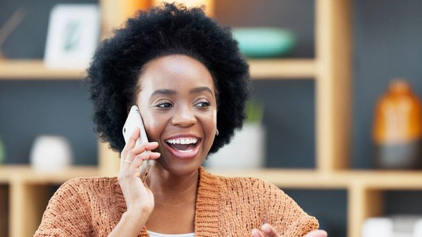 Business woman answering her phone, smiling, laughing and chatting in the office. Happy female designer making a phonecall to a customer, client or colleague to discuss and brainstorm creative ideas. - Foto, Imagem