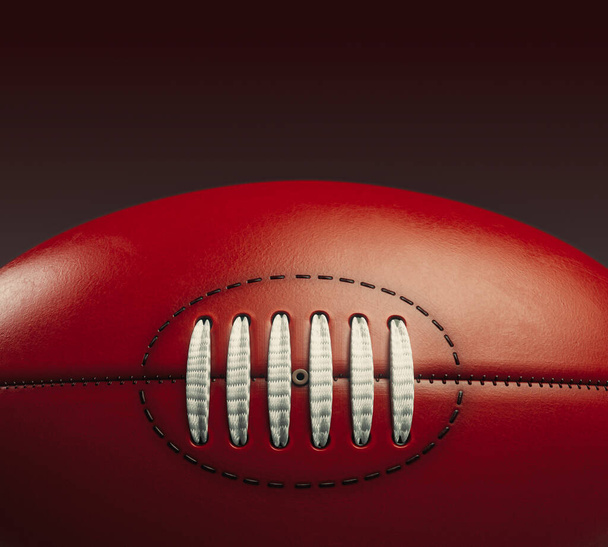 A generic unbranded aussie rules football ball on an isolated dark studio background - 3D render - Φωτογραφία, εικόνα