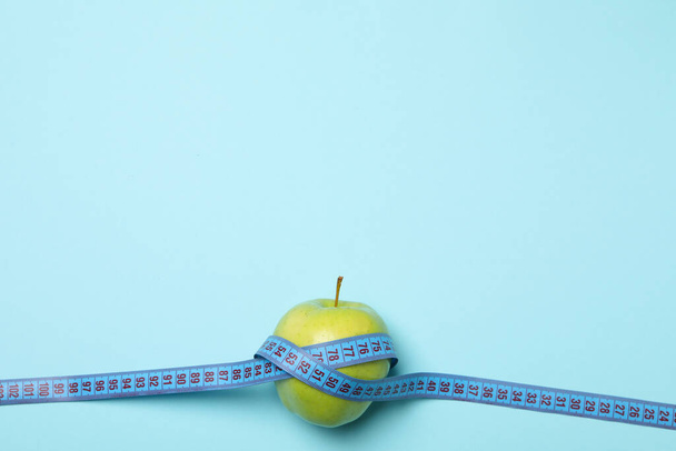 Diet and weight loss, healthy lifestyle, composition with measuring tape, space for text - Fotografie, Obrázek