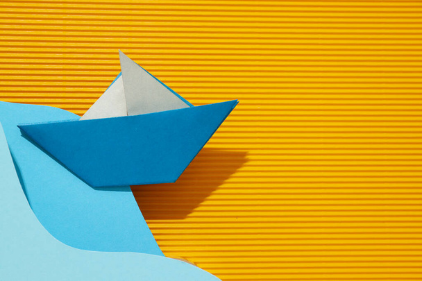 Concept of travel and adventure with paper boat - Foto, imagen