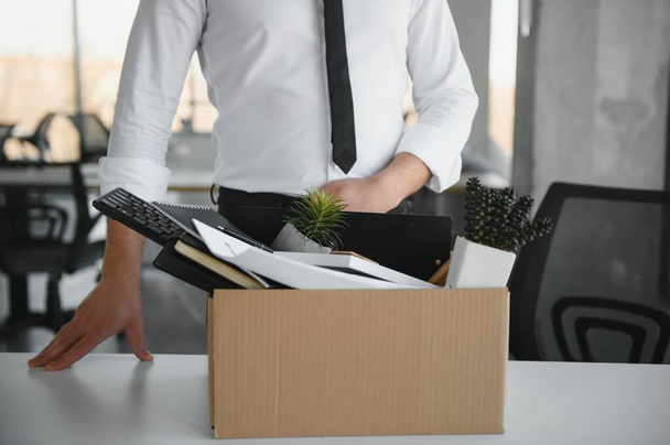 Close-up Of A Businessperson Carrying Cardboard Box During Office Meeting. - Valokuva, kuva