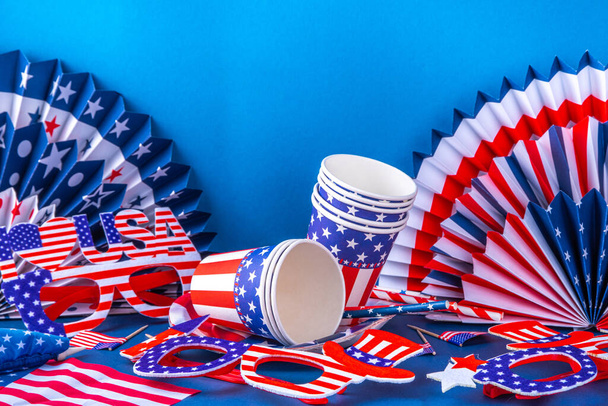 Happy Labor Day, Presidents Day, Fourth of July Independent Day, Memorial day, Columbus day background. Blue background with USA flag color paper fans and decorations, party accessories - Фото, изображение