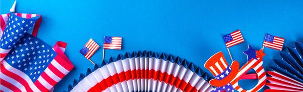 Happy Labor Day, Presidents Day, Fourth of July Independent Day, Memorial day, Columbus day background. Blue background with USA flag color paper fans and decorations, party accessories - Photo, image