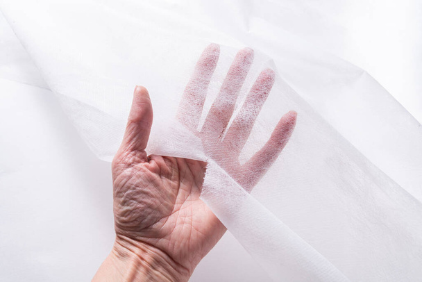 Woman hands working with  Covering Roll for Medical Bed - Foto, Bild